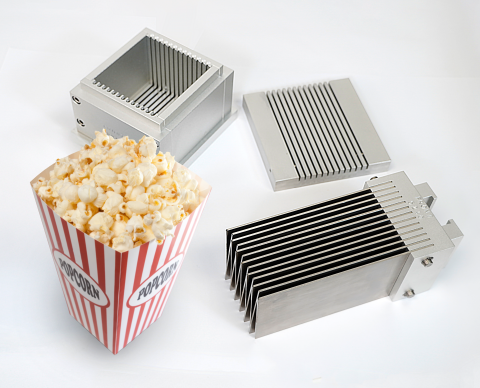 Kramer shear cell components with a box container of a popcorn serving